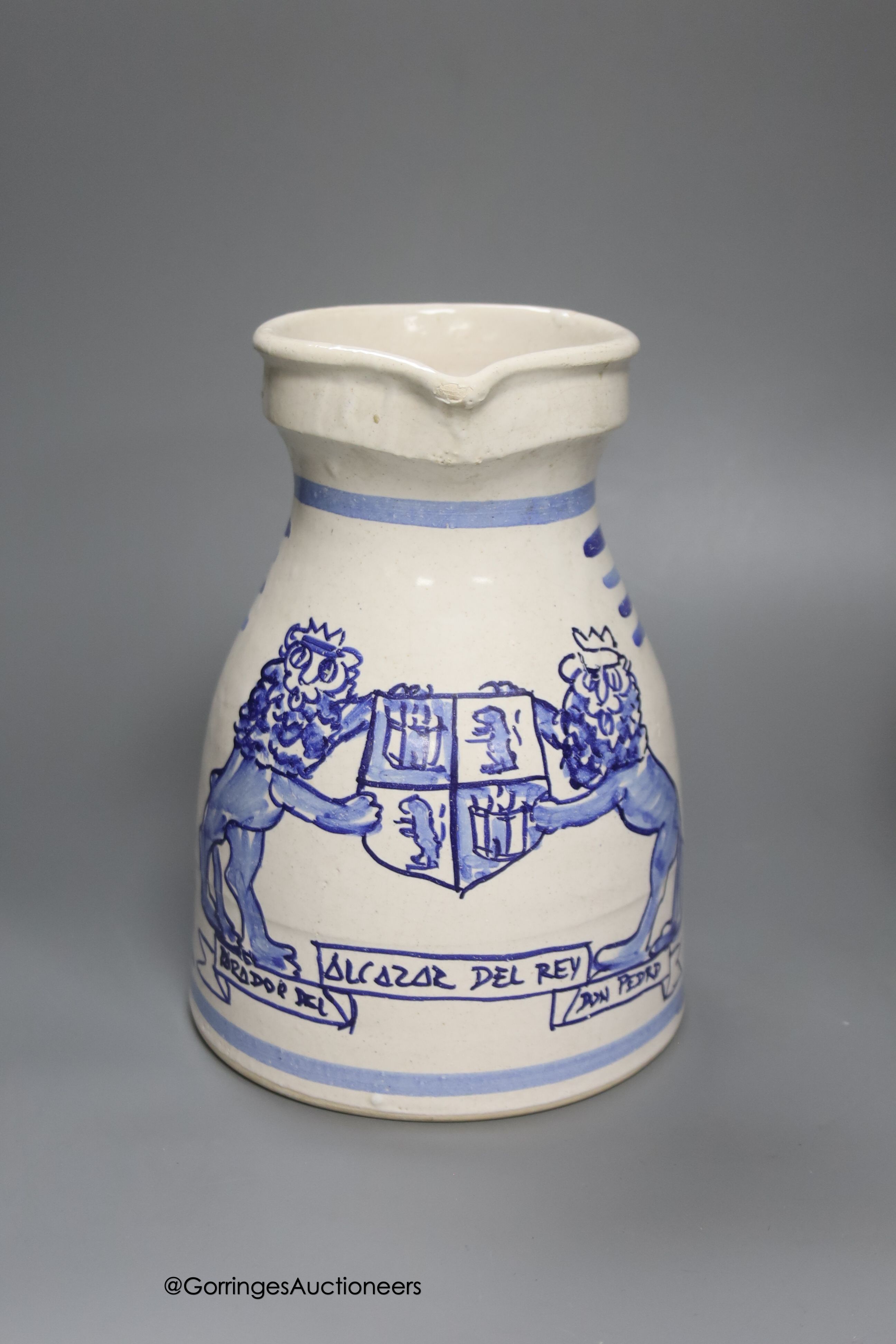 A tin-glazed terracotta barber's bowl dated 1819, a large ovoid eathenware ‘Taback’ jar and three earthenware jugs